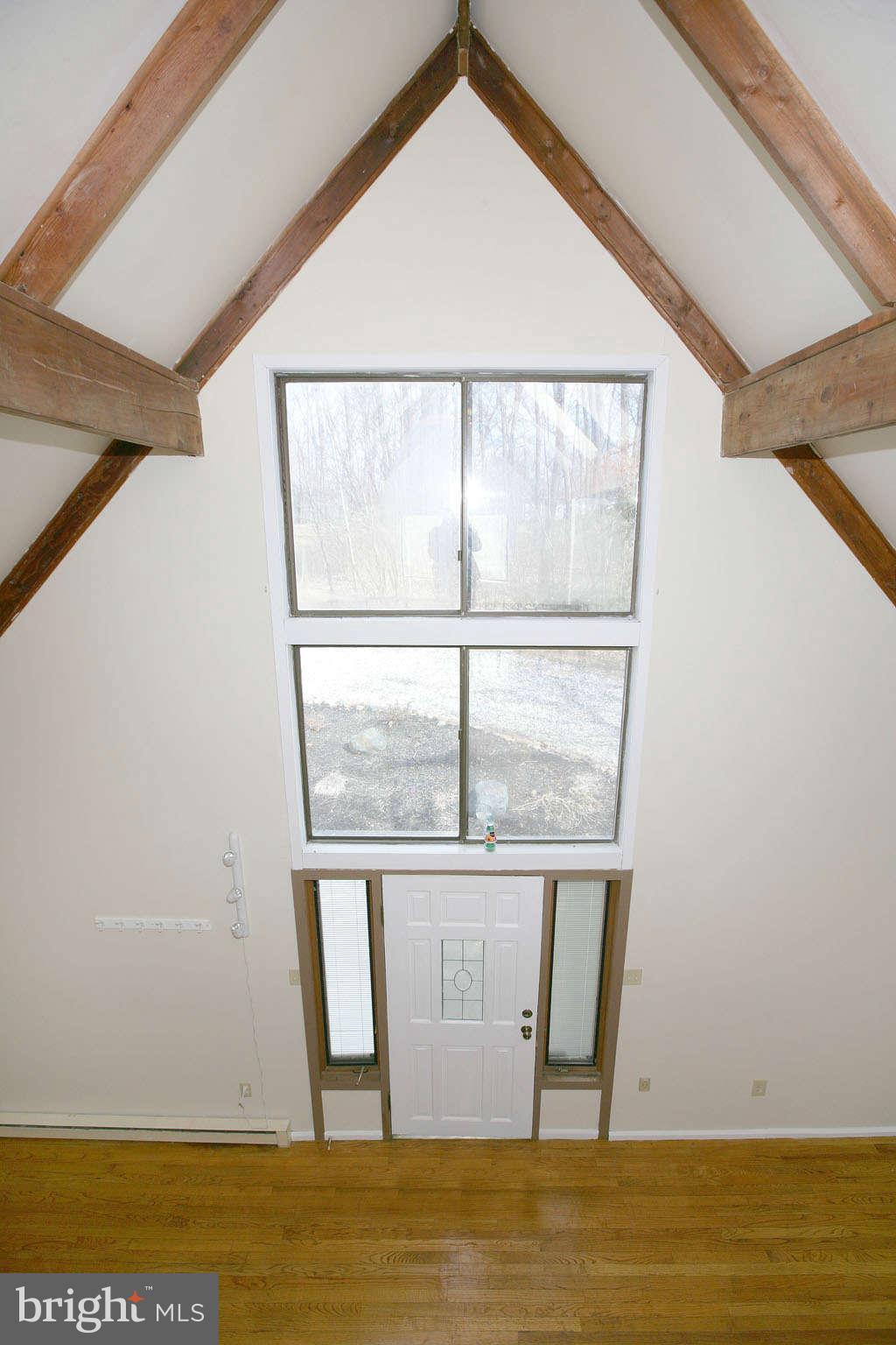 13217 Highland Road Highland, MD 20777 - Photo 8 of 23 a view of a room with wooden floor and a window