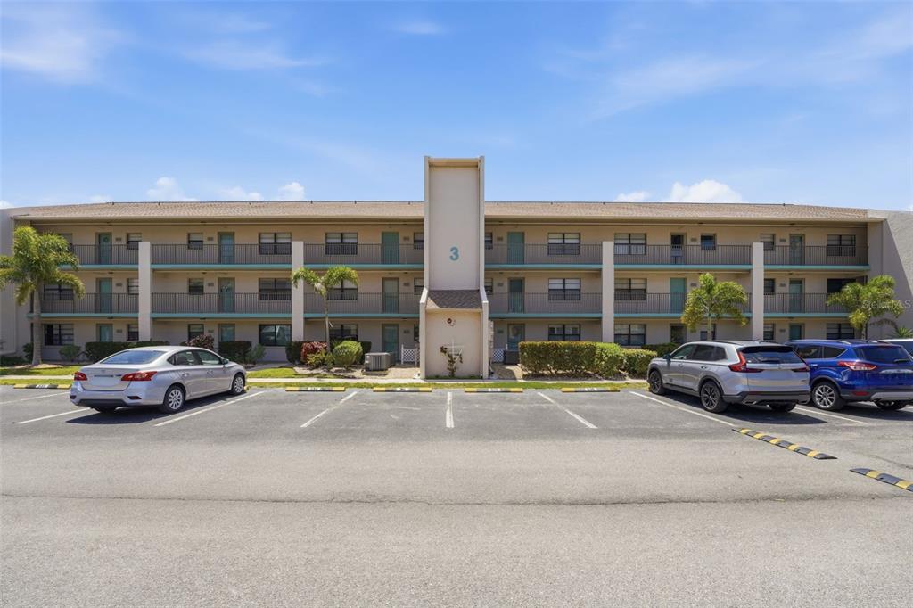 175 Kings Highway, Unit 328 Punta Gorda, FL 33983 - Photo 1 of 41 a car parked in front of a building