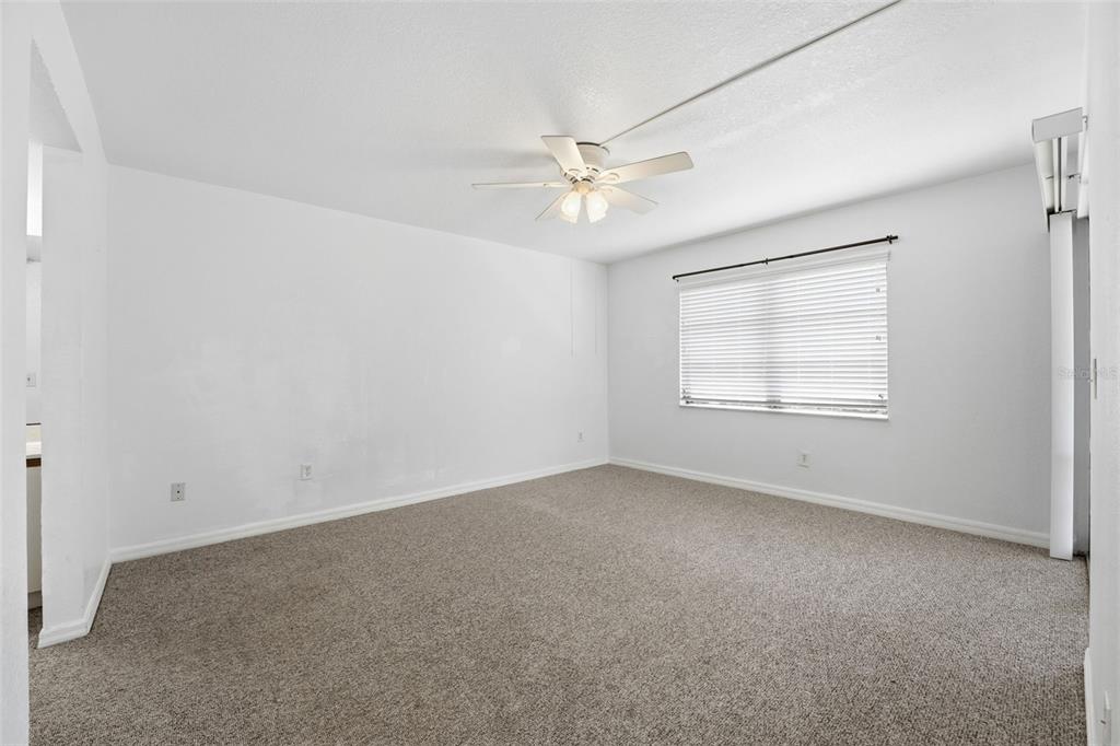 175 Kings Highway, Unit 328 Punta Gorda, FL 33983 - Photo 21 of 41 an empty room with a window and ceiling fan