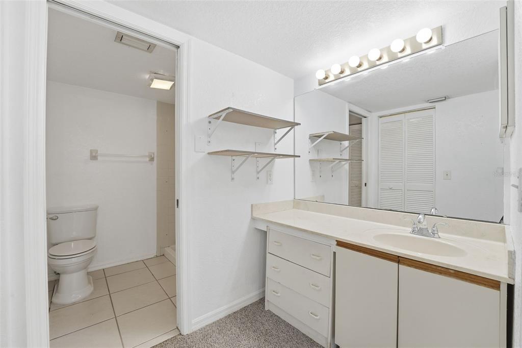 175 Kings Highway, Unit 328 Punta Gorda, FL 33983 - Photo 25 of 41 a bathroom with a sink toilet and shower