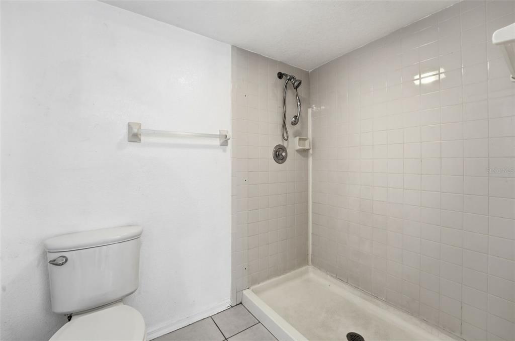 175 Kings Highway, Unit 328 Punta Gorda, FL 33983 - Photo 26 of 41 a bathroom with a toilet and shower