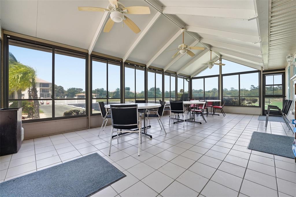 175 Kings Highway, Unit 328 Punta Gorda, FL 33983 - Photo 32 of 41 a room with lots of furniture and a floor to ceiling window