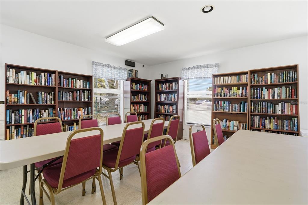 175 Kings Highway, Unit 328 Punta Gorda, FL 33983 - Photo 36 of 41 a view of a dining room with furniture and a bookshelf