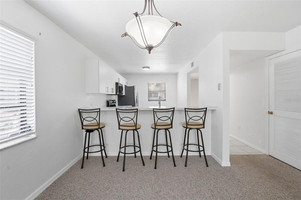175 Kings Highway, Unit 328 Punta Gorda, FL 33983 - Photo 10 of 41 a view of a dining room with furniture