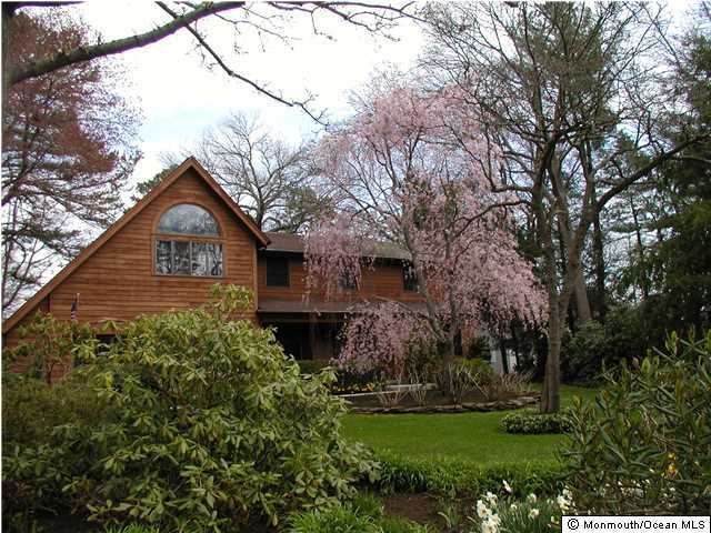 2632 River Road Manasquan, NJ 08736 - Photo 1 of 17 a front view of a house with a yard