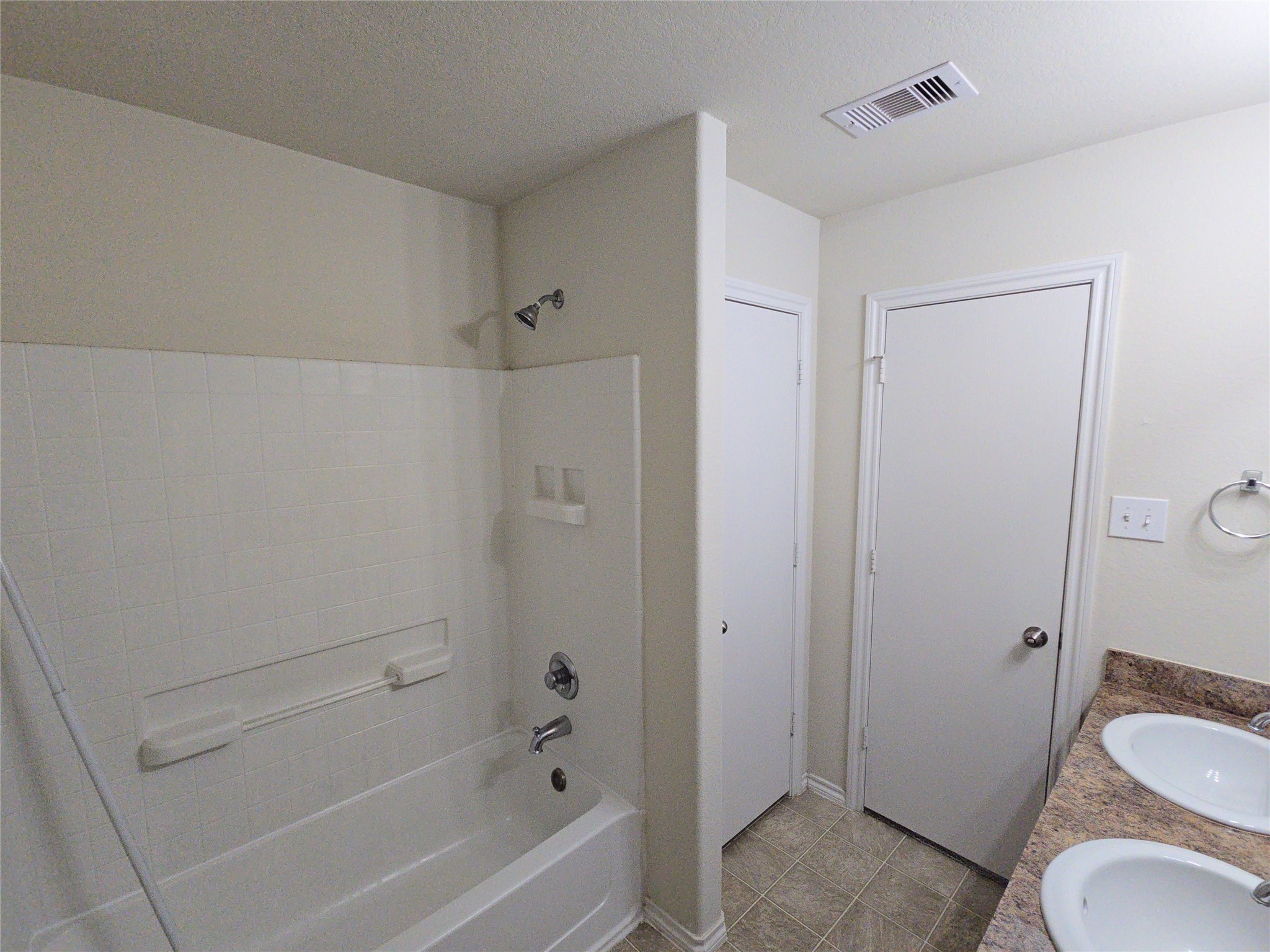 810 Lightningbug Lane Conroe, TX 77301 - Photo 9 of 27 a bathroom with a sink toilet and shower