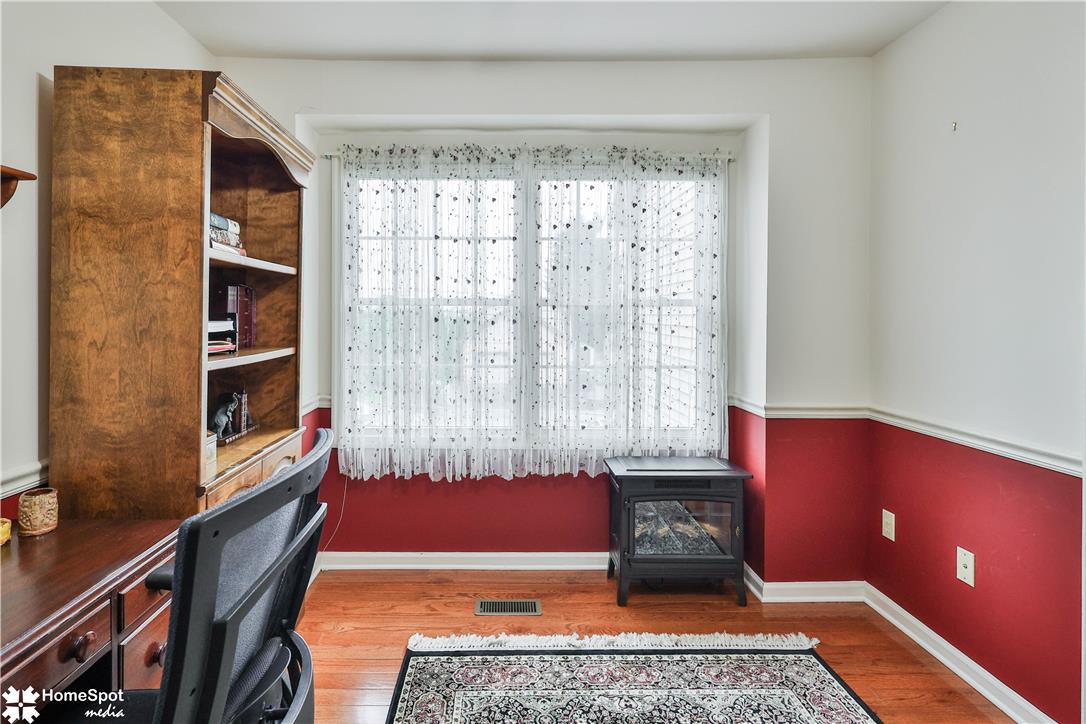 507 Howertown Road Northampton, PA 18067 - Photo 29 of 46 A window-filled study featuring rich hardwood floors and a cozy fireplace.