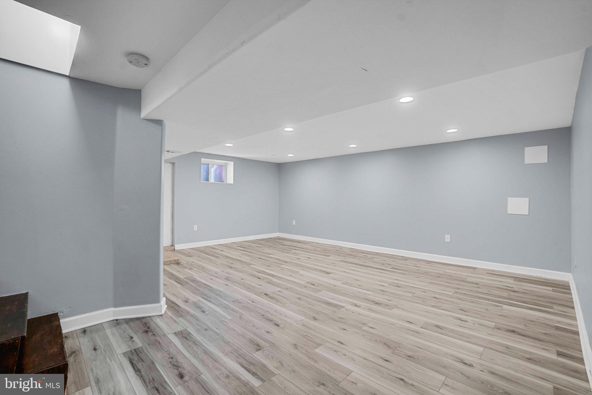 5922 Baltimore Street Baltimore, MD 21207 - Photo 24 of 33 a view of an empty room with wooden floor