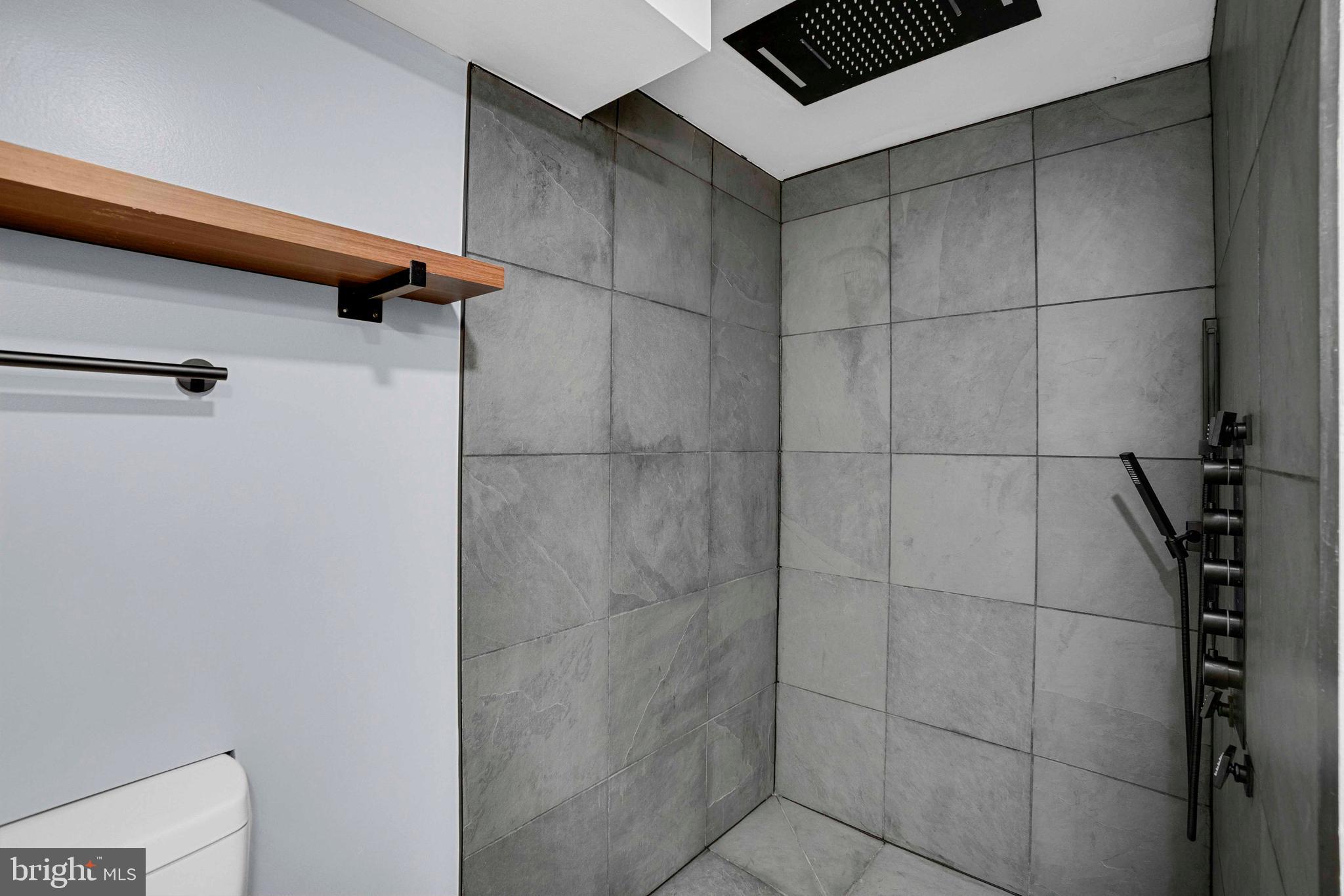 5922 Baltimore Street Baltimore, MD 21207 - Photo 29 of 33 a bathroom with a shower