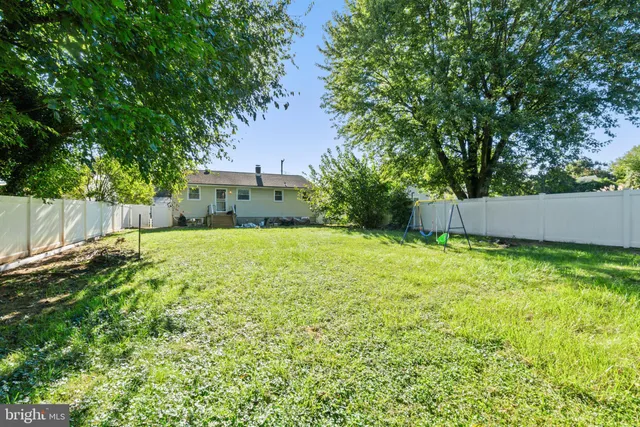 a view of a backyard with a small cabin