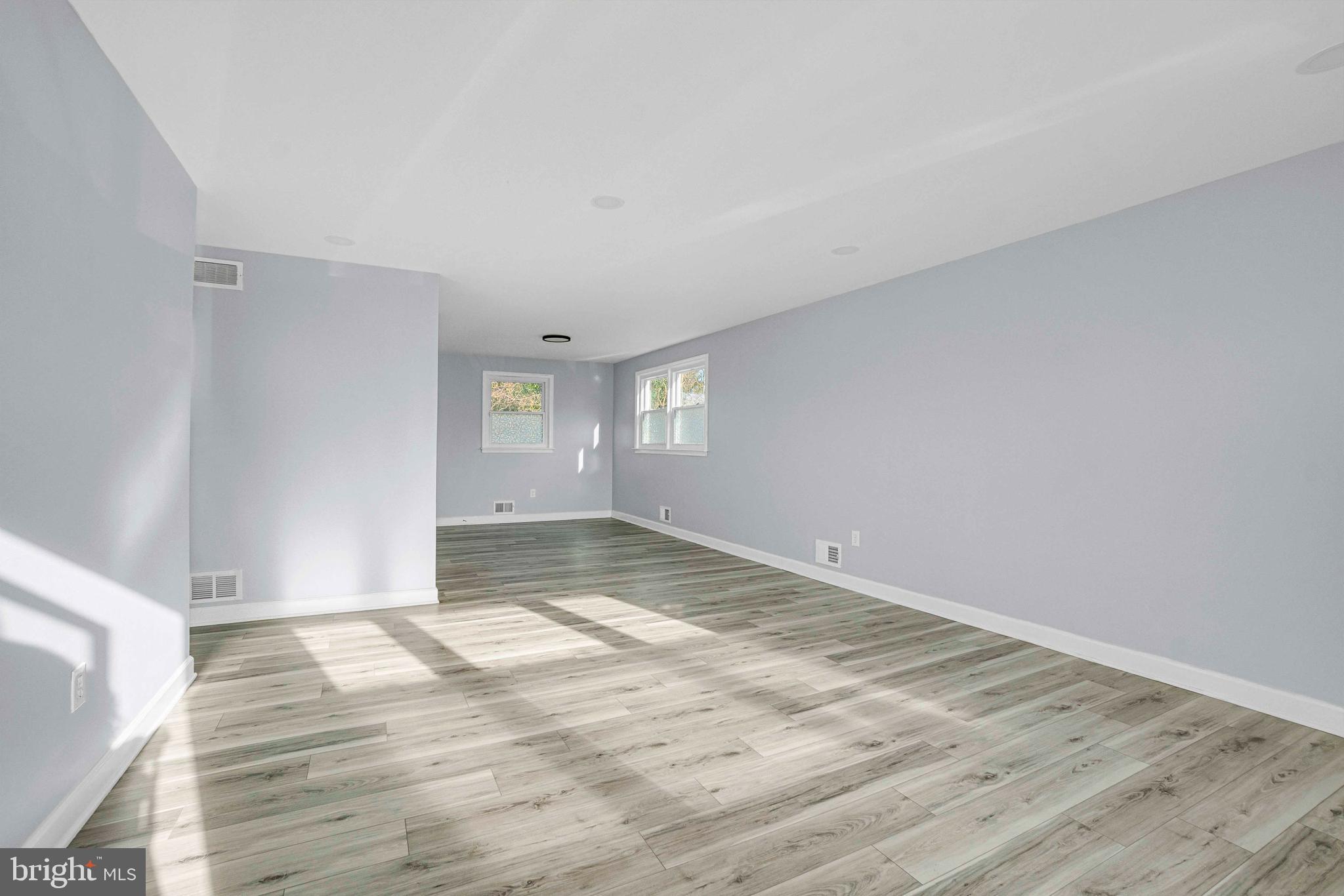 5922 Baltimore Street Baltimore, MD 21207 - Photo 4 of 33 a view of empty room with wooden floor