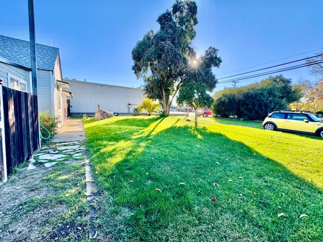 a view of a backyard with swimming pool