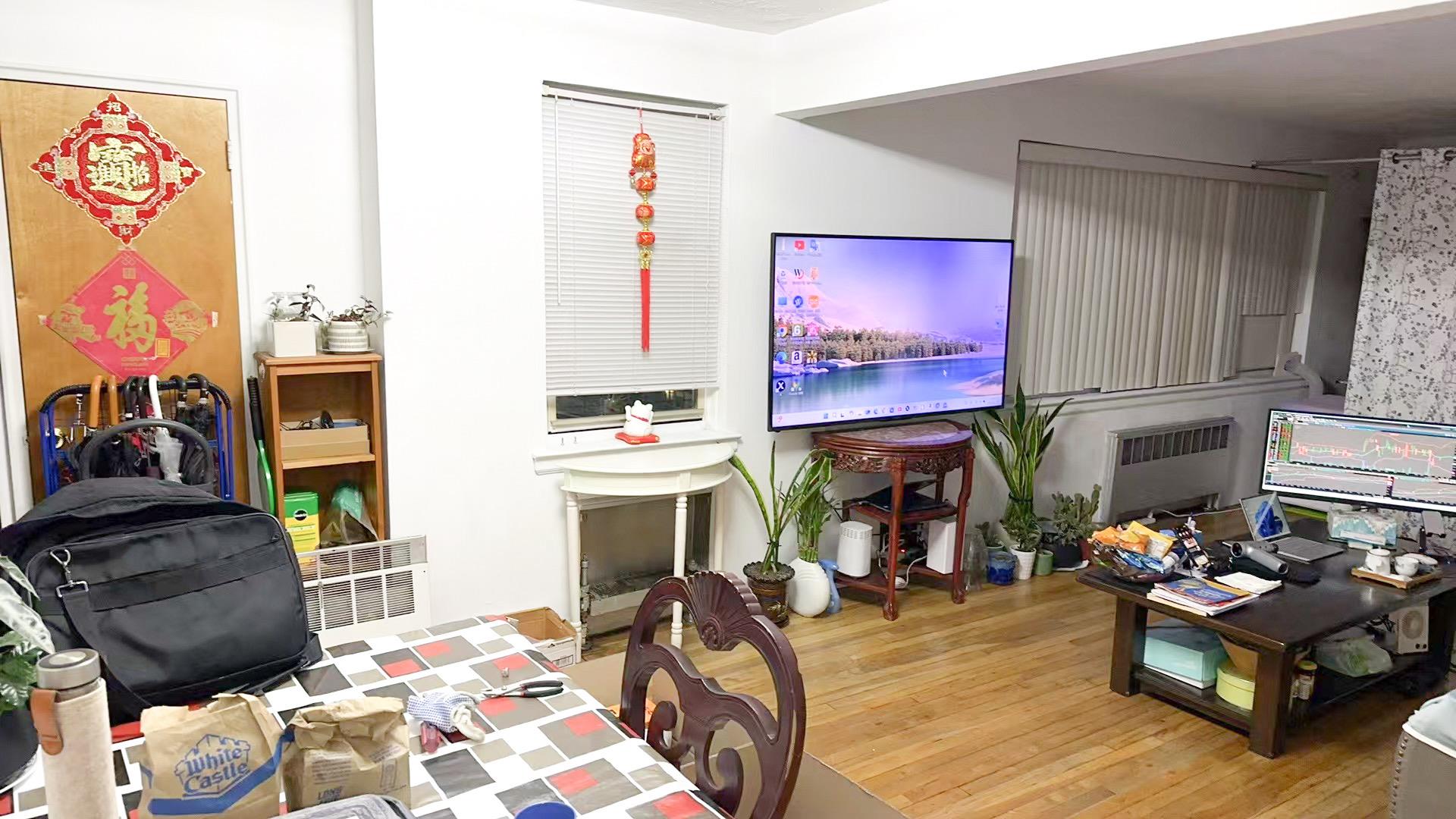 138-32 68th Drive, Unit 2B Queens, NY 11367 - Photo 3 of 10 a living room with furniture and a fireplace