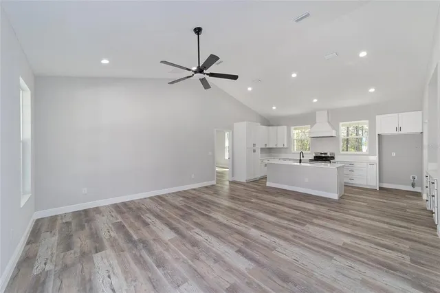 a view of kitchen with wooden floor and window