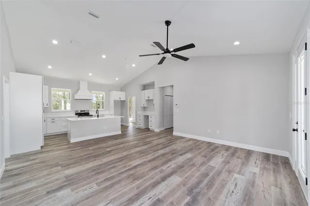 a view of kitchen with wooden floor and window