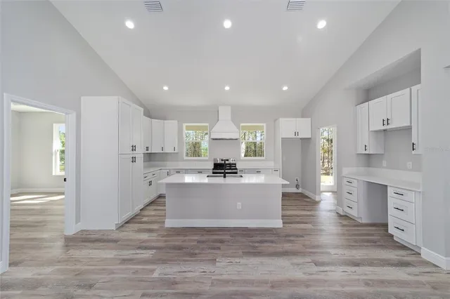 a view of kitchen with center island and stainless steel appliances