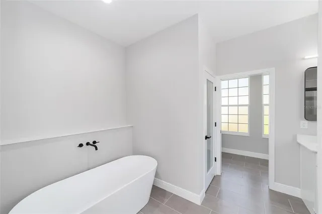 a bathroom with a bathtub and toilet