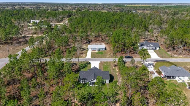 an aerial view of residential house with outdoor space