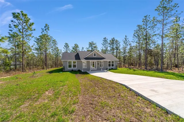 a view of a house with a big yard