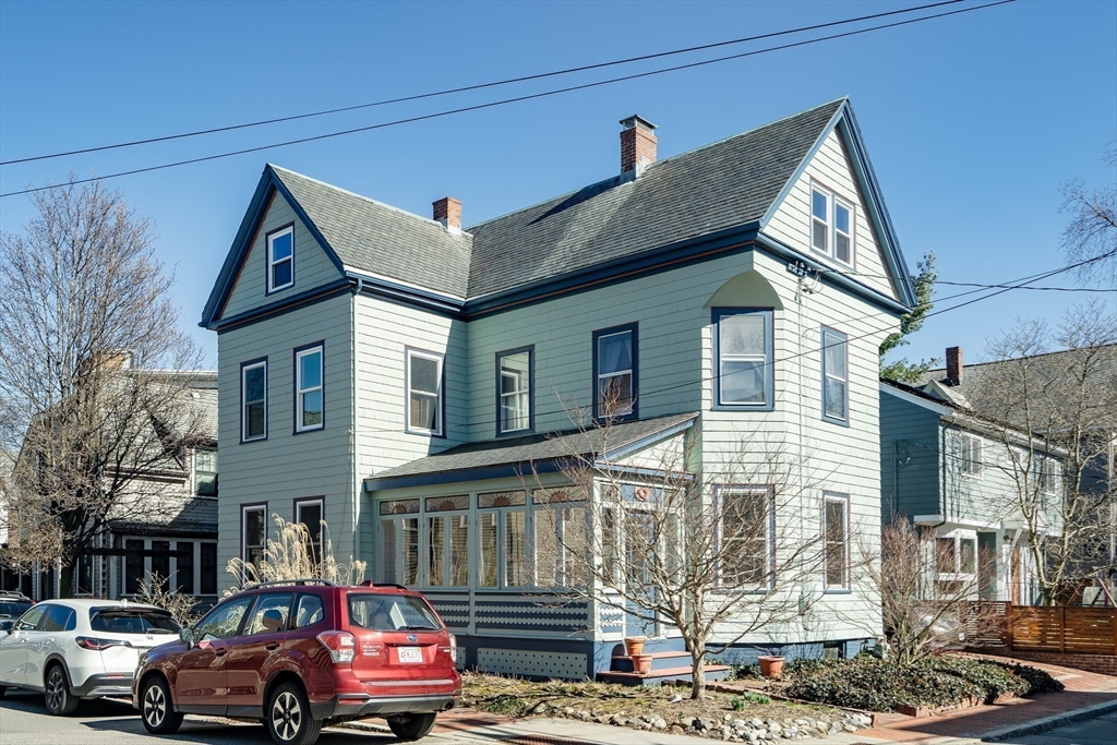 a front view of a house with parking space