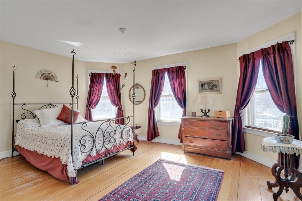 32 Locke Street Cambridge, MA 02140 - Photo 20 of 32 a bedroom with a bed couch and a window