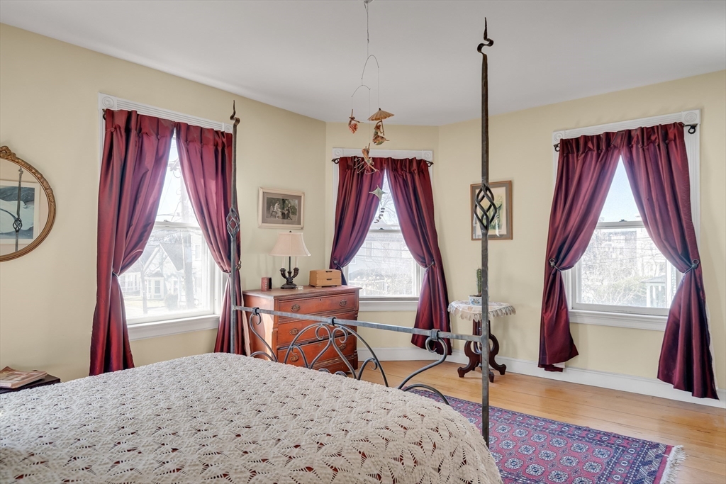 32 Locke Street Cambridge, MA 02140 - Photo 21 of 32 a view of a bedroom with furniture and windows