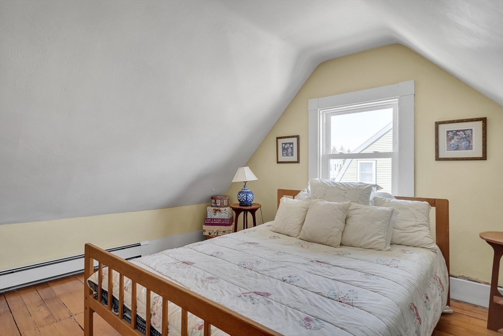 32 Locke Street Cambridge, MA 02140 - Photo 23 of 32 a bedroom with a bed and a window