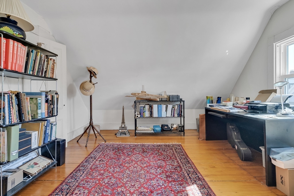 32 Locke Street Cambridge, MA 02140 - Photo 25 of 32 a living room with lots of furniture and kitchen view