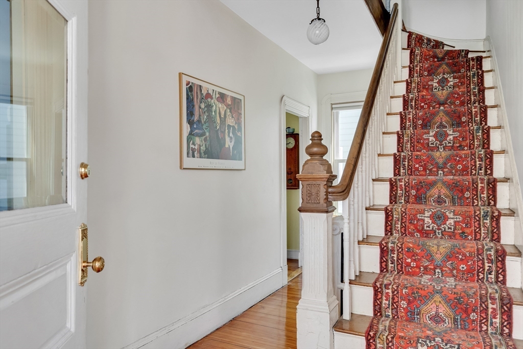 32 Locke Street Cambridge, MA 02140 - Photo 6 of 32 a view of stairs with wooden floor