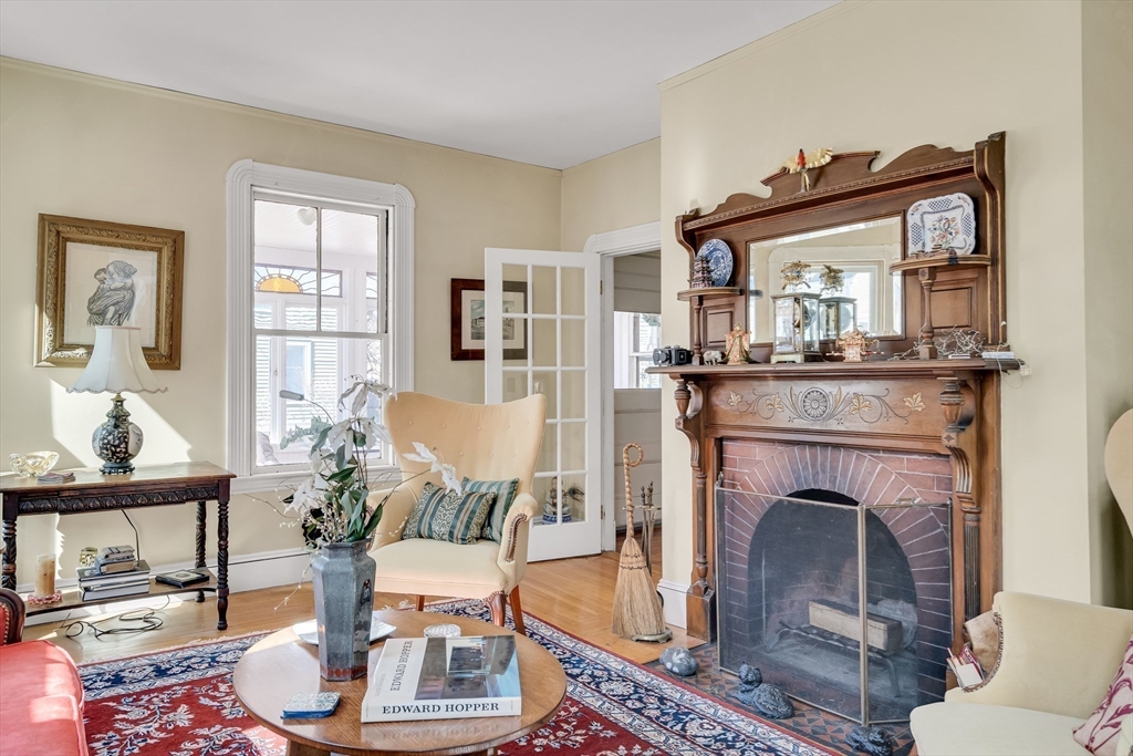 32 Locke Street Cambridge, MA 02140 - Photo 8 of 32 a living room with furniture and a fireplace