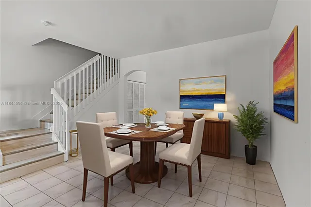 a view of a livingroom with furniture and a potted plant