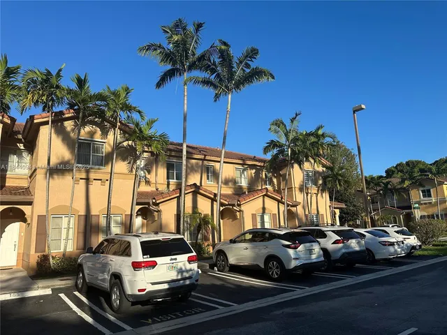 a view of a cars parked in front of a house