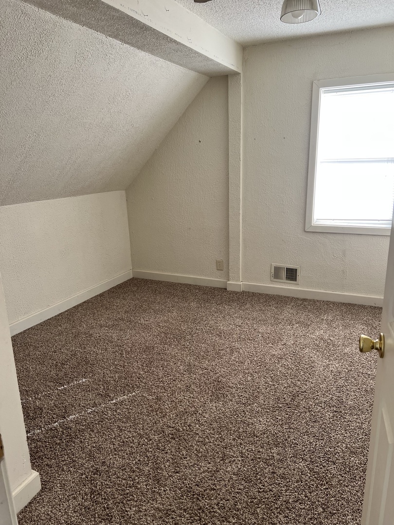 304 South 3rd Street Kirkland, IL 60146 - Photo 13 of 16 an empty room with a window