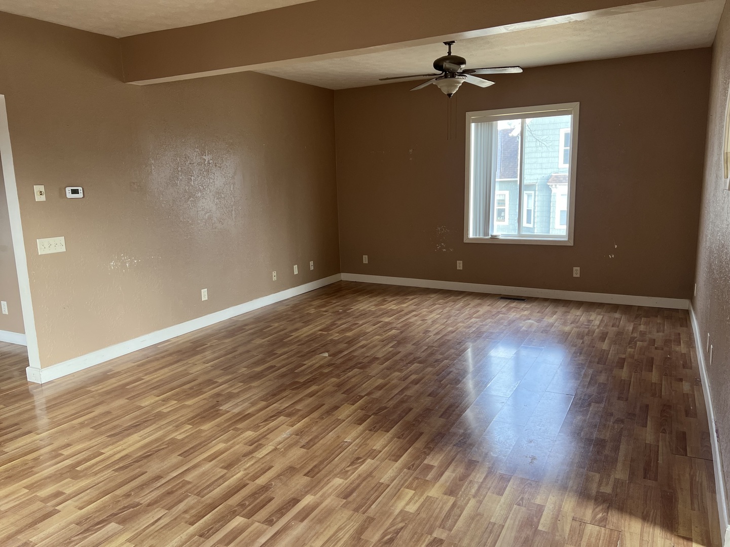 304 South 3rd Street Kirkland, IL 60146 - Photo 5 of 16 wooden floor in an empty room with a window