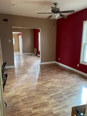 a view of a livingroom with wooden floor