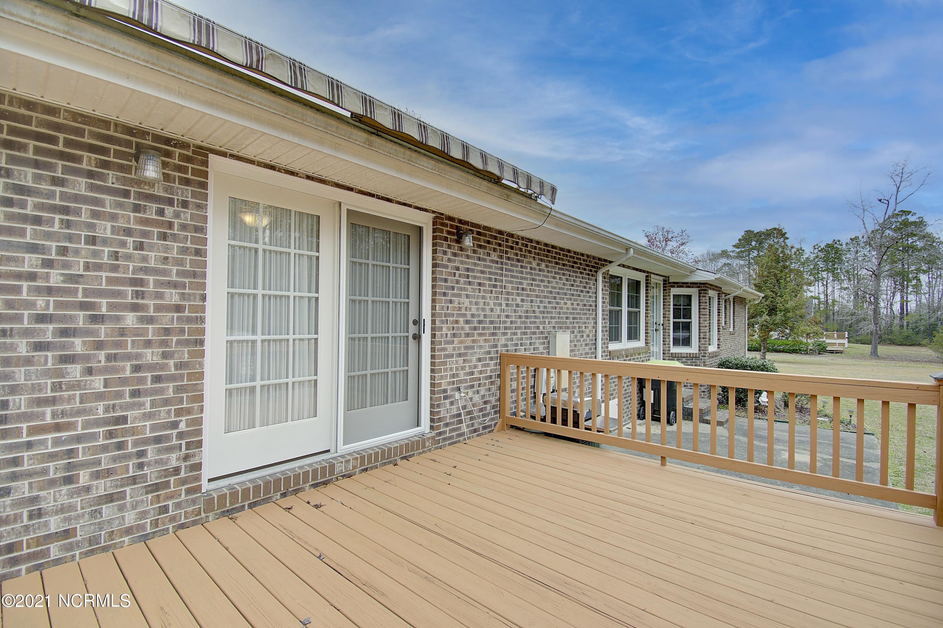 740 Stone Chimney Road Southwest Supply, NC 28462 - Photo 36 of 41 Open deck with retractable awning