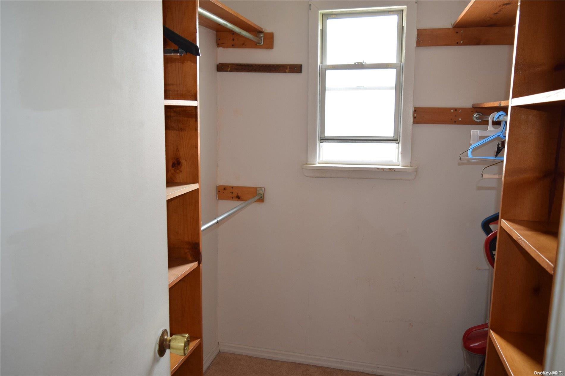 Undisclosed Address Queens, NY 11365 - Photo 11 of 18 a room with a window and gym equipment