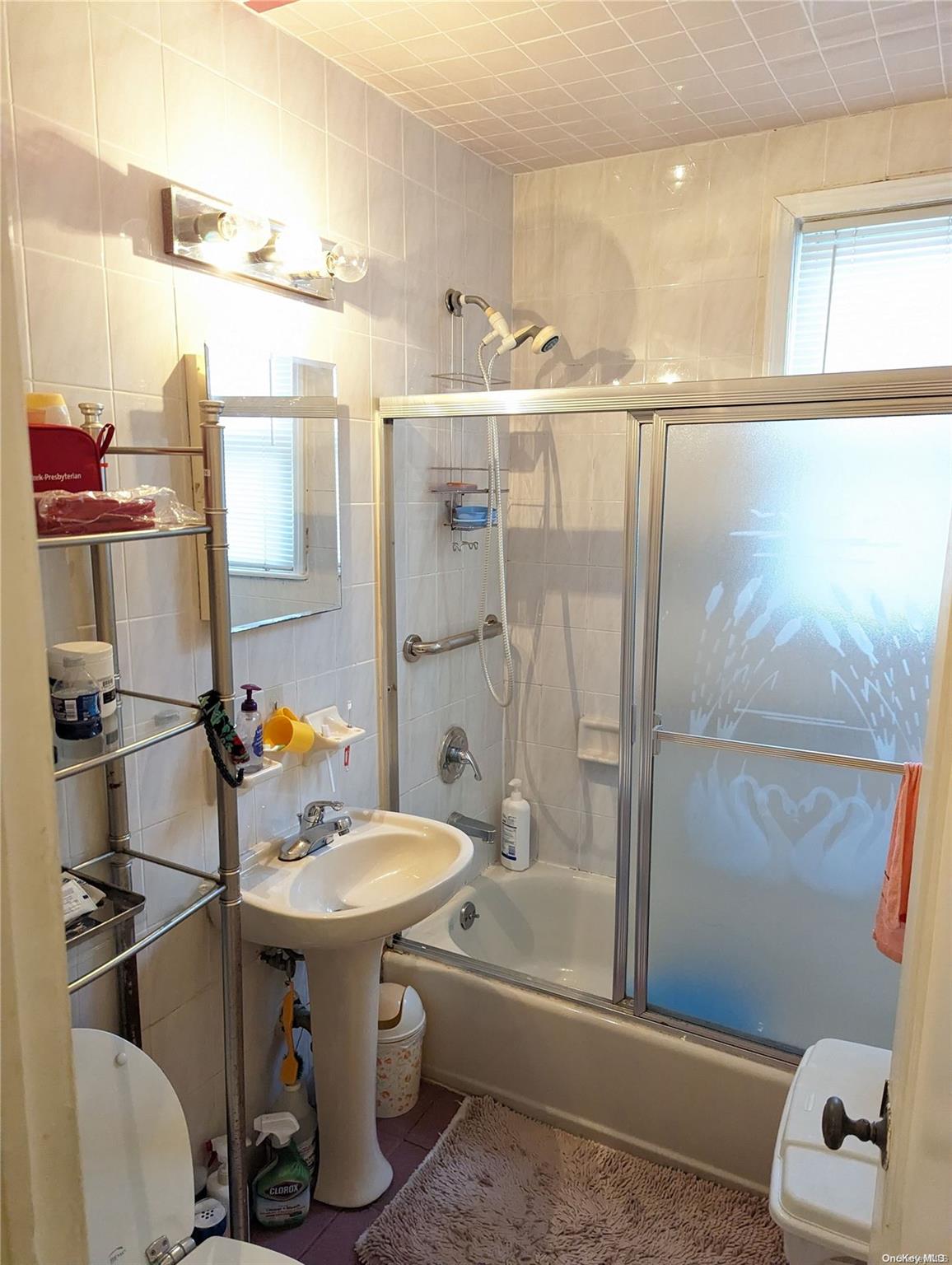 Undisclosed Address Queens, NY 11365 - Photo 14 of 18 a bathroom with a sink toilet and shower