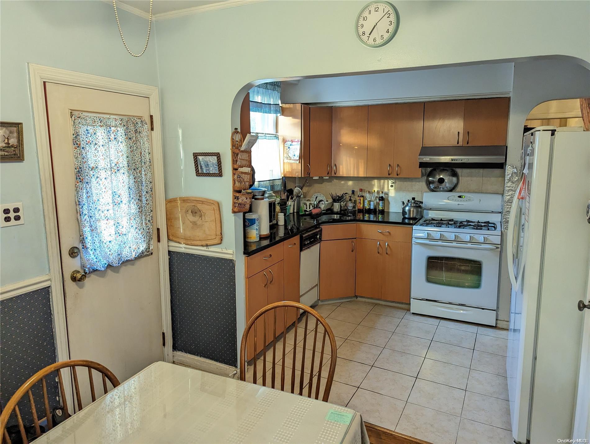 Undisclosed Address Queens, NY 11365 - Photo 3 of 18 a kitchen with stainless steel appliances granite countertop a stove a sink and a refrigerator