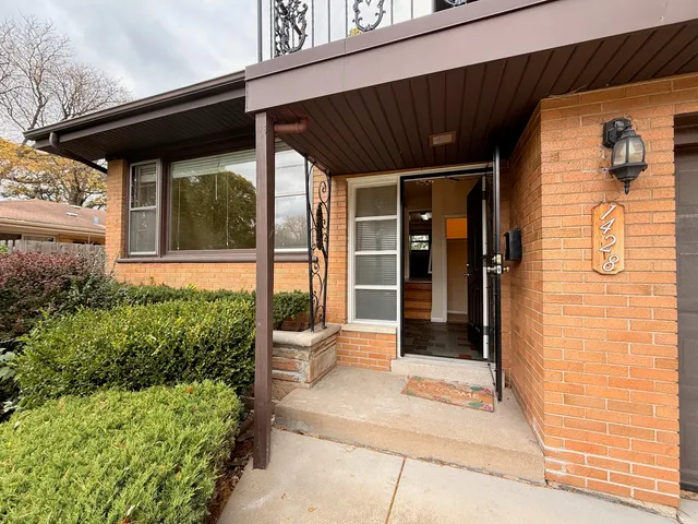 a front view of a house with a porch