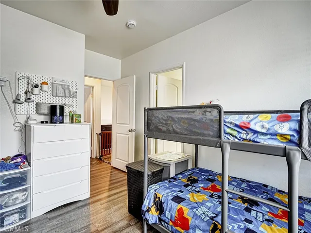 a bedroom with furniture and a baby crib