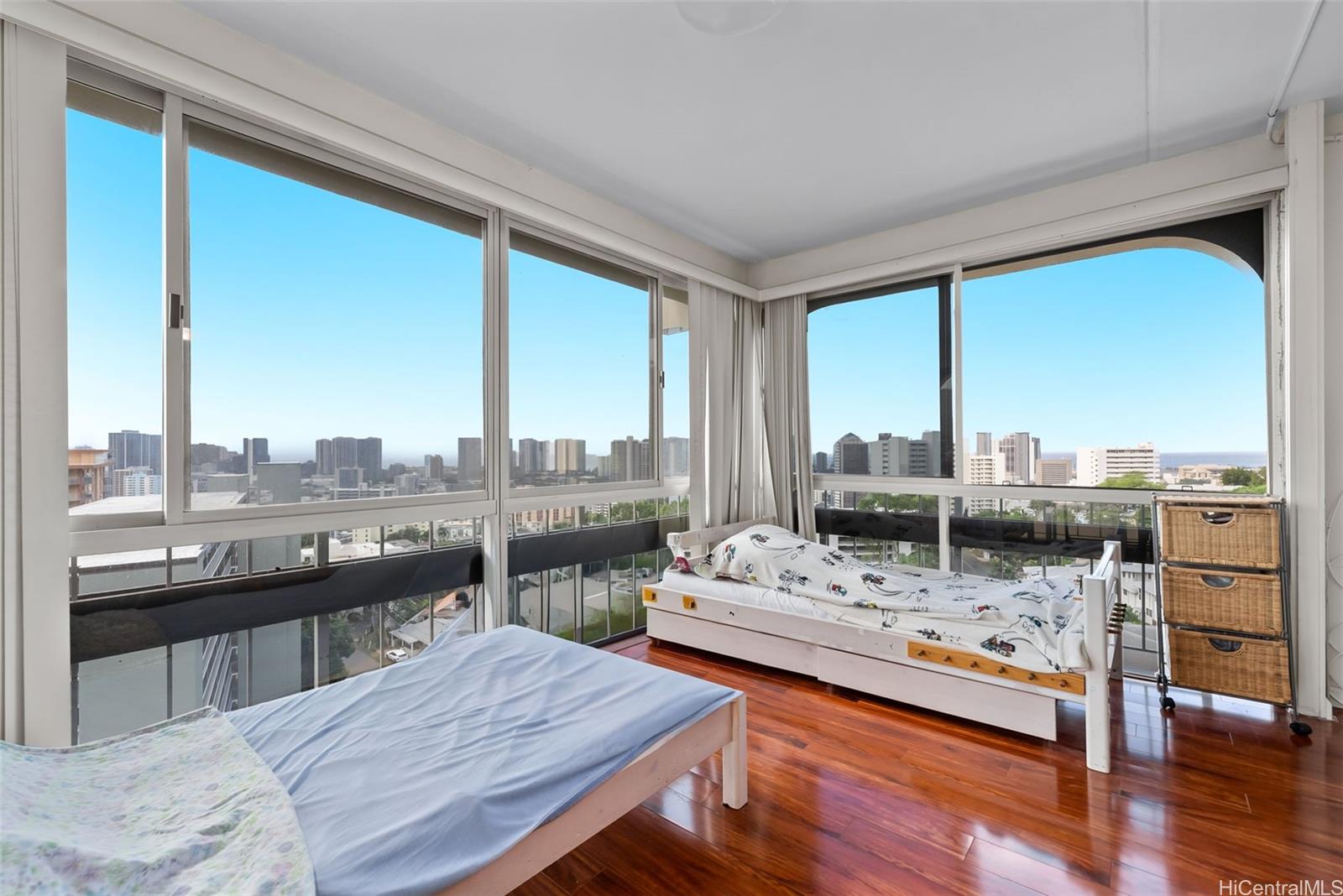 1022 Prospect Street, Unit 902B Honolulu, HI 96813 - Photo 18 of 25 a living room with furniture and a floor to ceiling window