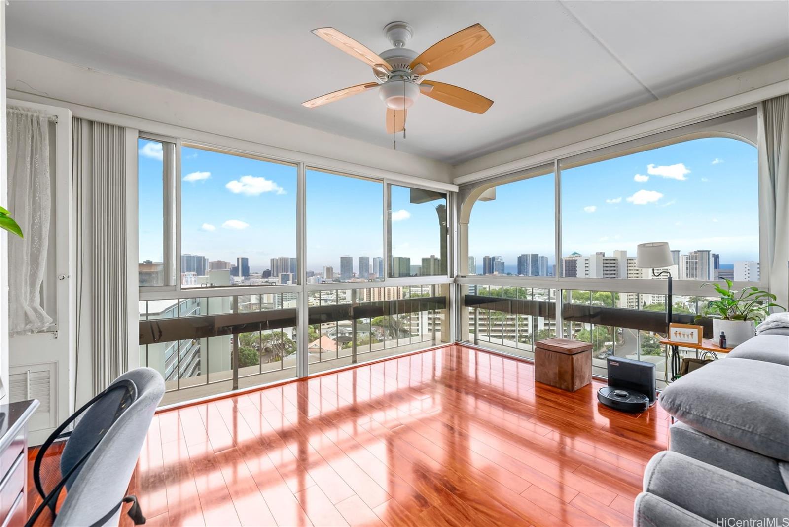 1022 Prospect Street, Unit 902B Honolulu, HI 96813 - Photo 2 of 25 a view of a living room with furniture and a floor to ceiling window