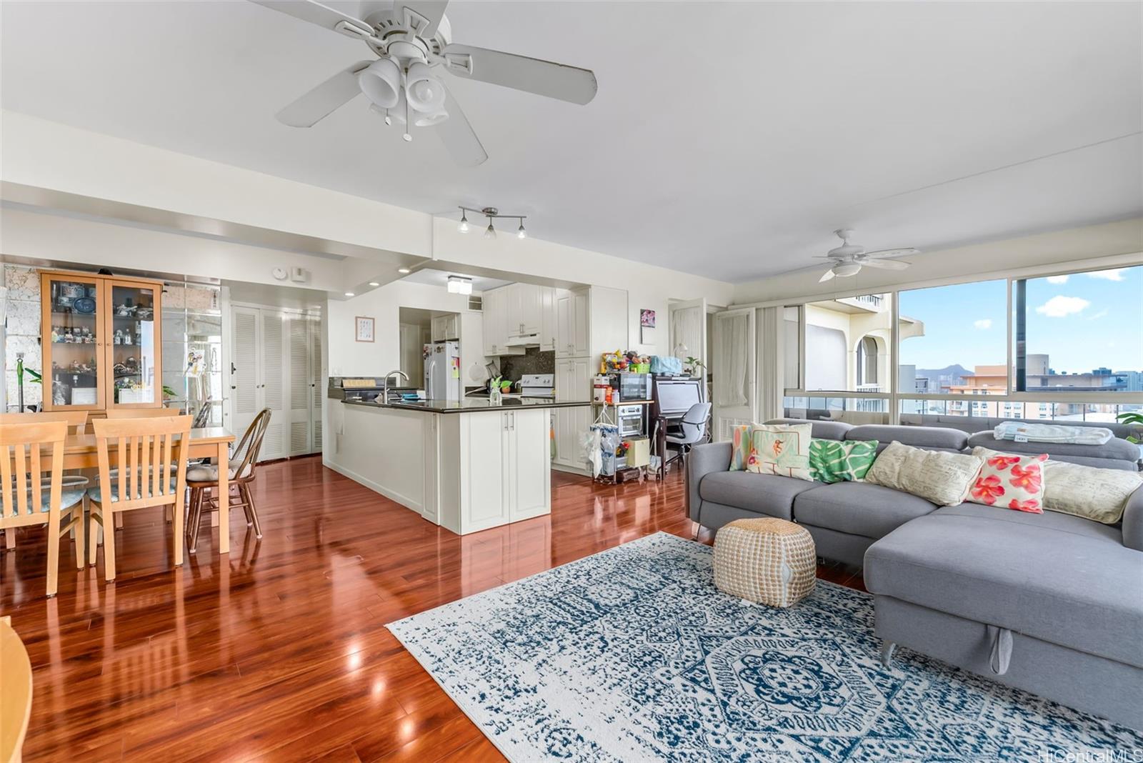 1022 Prospect Street, Unit 902B Honolulu, HI 96813 - Photo 3 of 25 a living room with furniture and wooden floor