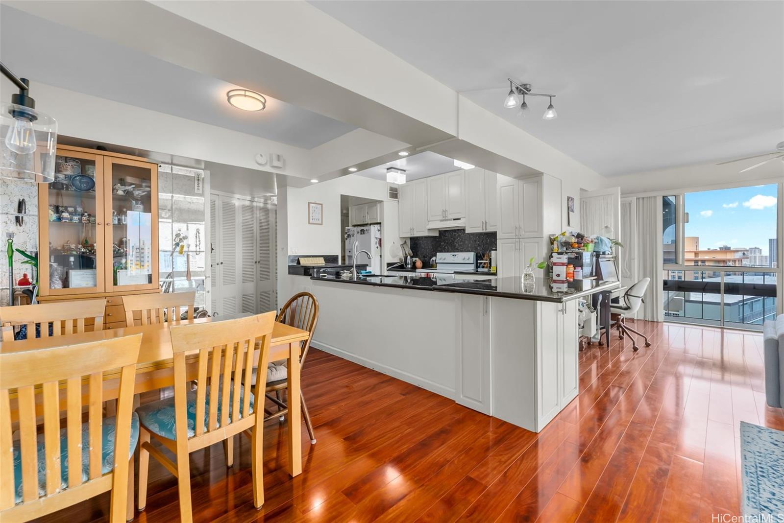 1022 Prospect Street, Unit 902B Honolulu, HI 96813 - Photo 4 of 25 a dining room with furniture and wooden floor