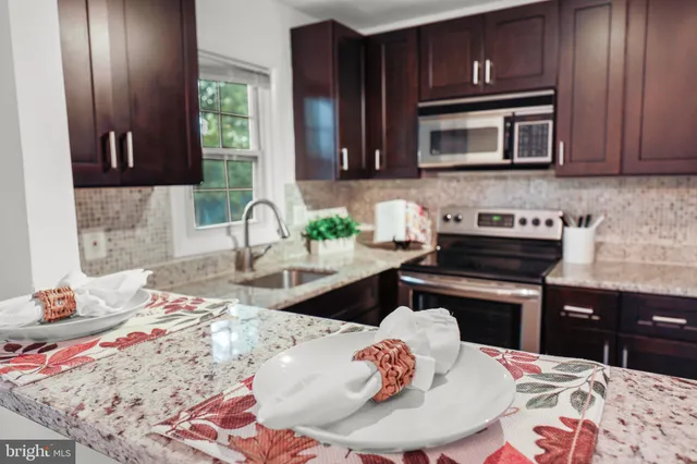 a kitchen with a sink and a stove