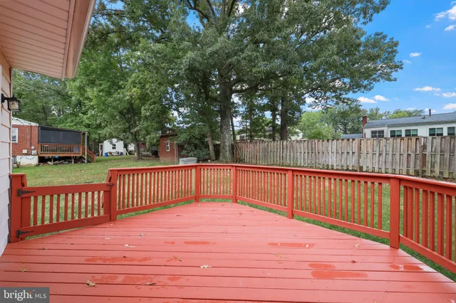 a view of a balcony with wooden floor