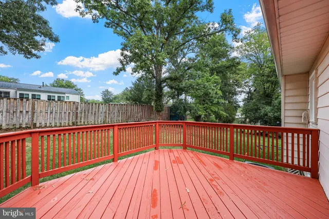 a front view of a house with yard and green space