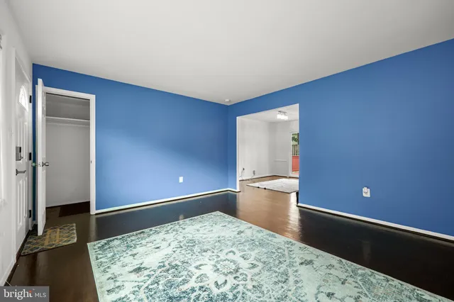 a view of a room with a barbeque and wooden floor