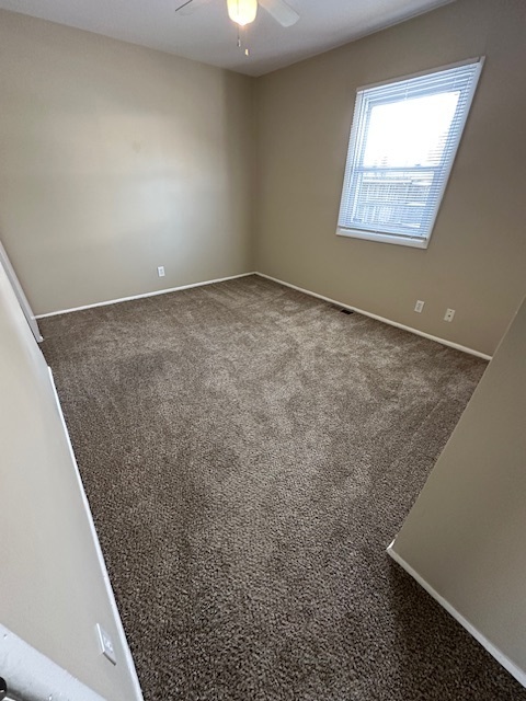 209 Andover Court Bolingbrook, IL 60440 - Photo 11 of 14 an empty room with windows